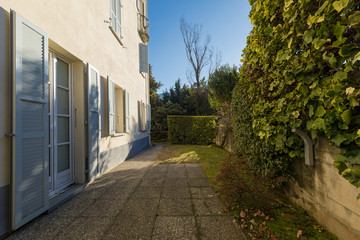 Back of the house, garden with green lawn