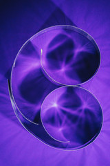 elevated view of paper spirals on purple