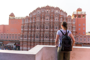 travel girl in front of Hawa Mahal (Palace of Winds) , Jaipur