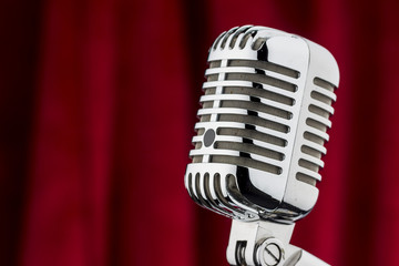 retro microphone in front of red velvet