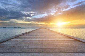 Naklejka na ściany i meble Boardwalk or wooden bridge to the sea at sunset beach in Koh Samui