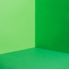 empty corner with green walls and floor