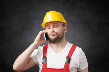 Construction worker using smartphone