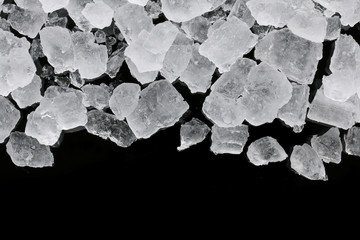 crushed ice cube texture on black background