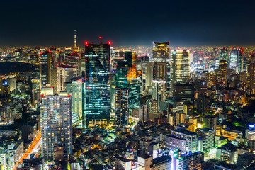 Fototapeta na wymiar Asia Business concept for real estate & corporate construction - panoramic modern city skyline view of Tokyo Metropolitan Expressway junction with neon night in Roppongi Hill, Tokyo, Japan