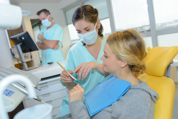 dentist curing a woman patient in the dental office