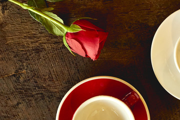 empty cups with red roses