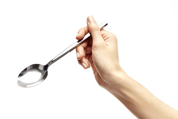 woman's right hand holds a spoon