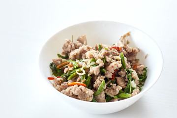 Topped with stir fried pork and basil