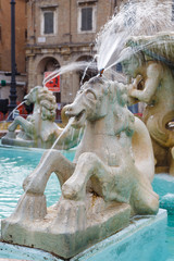 Fountain with lions on the square Piazza del Popolo in Pesaro. Details