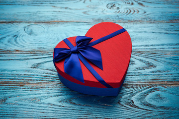 Valentines day background with present gift box in the form of a heart