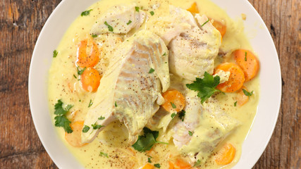 fish cooked with cream, carrot and curcuma
