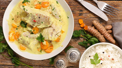 fish cooked with cream, carrot and curcuma