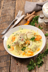 fish cooked with cream, carrot and curcuma
