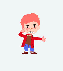 White boy in jeans, is angry and points his head with his index finger.