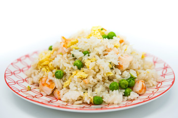 Homemade Chinese fried rice with vegetables and fried eggs