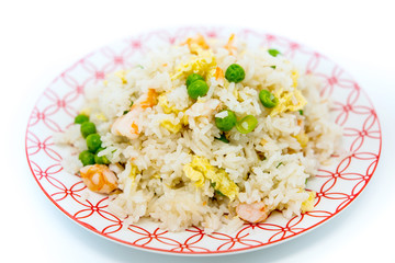 Homemade Chinese fried rice with vegetables and fried eggs