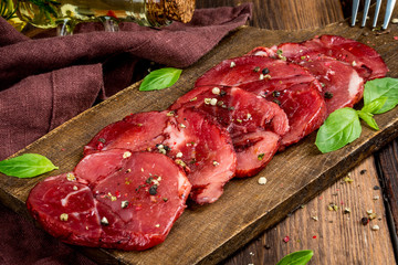 Smoked meat cut into pieces on the background