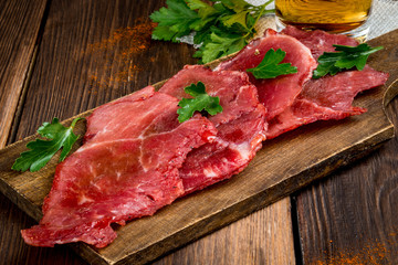 Smoked meat cut into pieces on the background