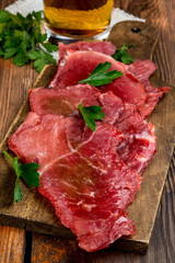 Smoked meat cut into pieces on the background