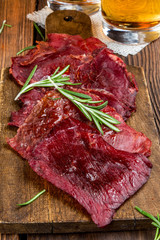 Smoked meat cut into pieces on the background