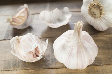Garlic on the wooden table - Allium sativum