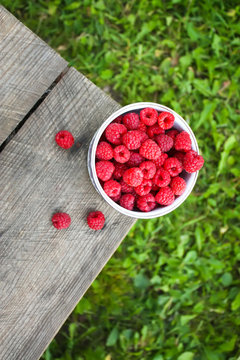 Raspberries on nature background.