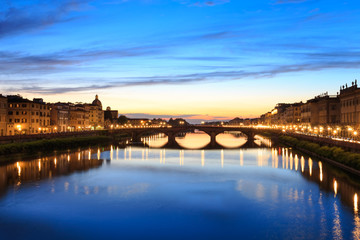 Fototapeta na wymiar Panoramic view of Florence Tuscany City, Housing, Buildings and Ponte alla Carraia and Arno River with Twilight sky scene in the night image