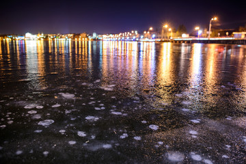Iced lake at night road