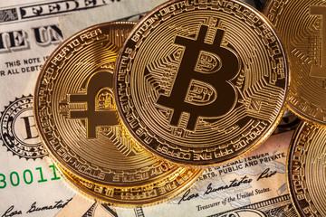 Fototapeta na wymiar golden bitcoin on money bills background