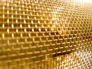 Gold mesh net with focus and shallow depto fo field, gold bokeh net pattern - 189737075