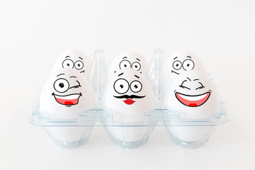 White eggs with funny faces.