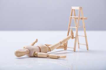 Wooden Figure Lying On Floor