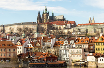 Fototapeta na wymiar old part of the city of Prague. The small country of the river Vlatva and the cathedral of St. Vitt is a panoramic view. Czech Republic Prague February 2017