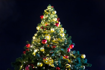 fir Christmas red gold balls mask decoration festive decoration, bright shiny fir-tree on a background of dark night sky