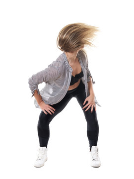 Action flowing hair motion of energetic dance hall woman aerobics instructor. Full body length portrait isolated on white studio background. 