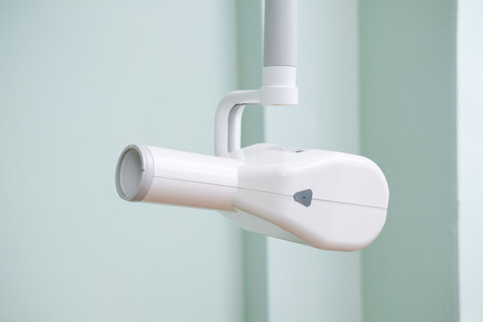 X-ray machine for the diagnosis of teeth,  digital X-ray of a patient`s teeth in the dental clinic