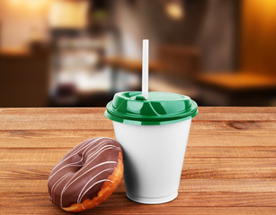 white mug grain coffee and donuts on a wooden table background