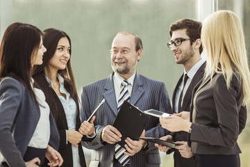 closeup of the boss and business team on office background