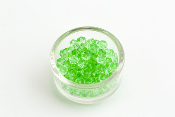 bowl of small light green rondelles for creating jewelry