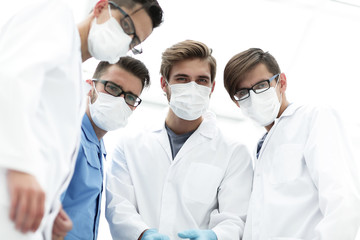 closeup. a team of doctors in protective masks.
