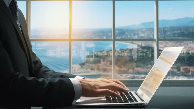 View of Nice France.Close up hand Businessman using laptop