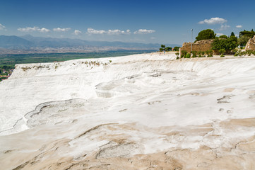 Sonny view of natural travertine pools and terraces in Pamukkale, Denizli province, Turkey.