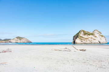 New Zealand wharariki beach and arch island rock formations - 189749458