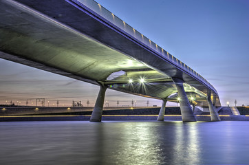 Fototapeta premium View from below of bridge De Lentloper accross the newly created channel near Lent in Nijmegen, The Netherlands