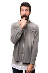 Fototapeta premium Handsome man with beard making vomiting gesture on white background