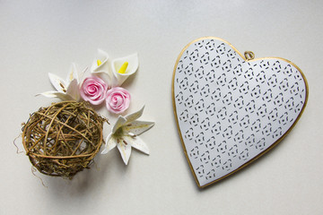 Pastel flowers, straw ball and big heart