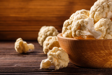 cauliflower and broccoli on a rustic background