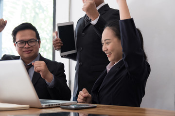 business team raise hands with happiness for successful project. cheerful businessman & businesswoman showing gladness for achievement