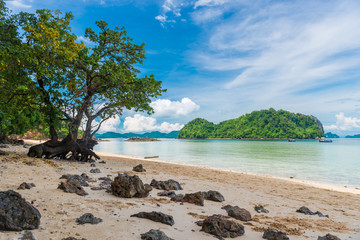 sandy shore with large stones on the sand and beautiful sea view, tropics, Thailand